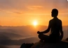 A person meditating before a golden horizon